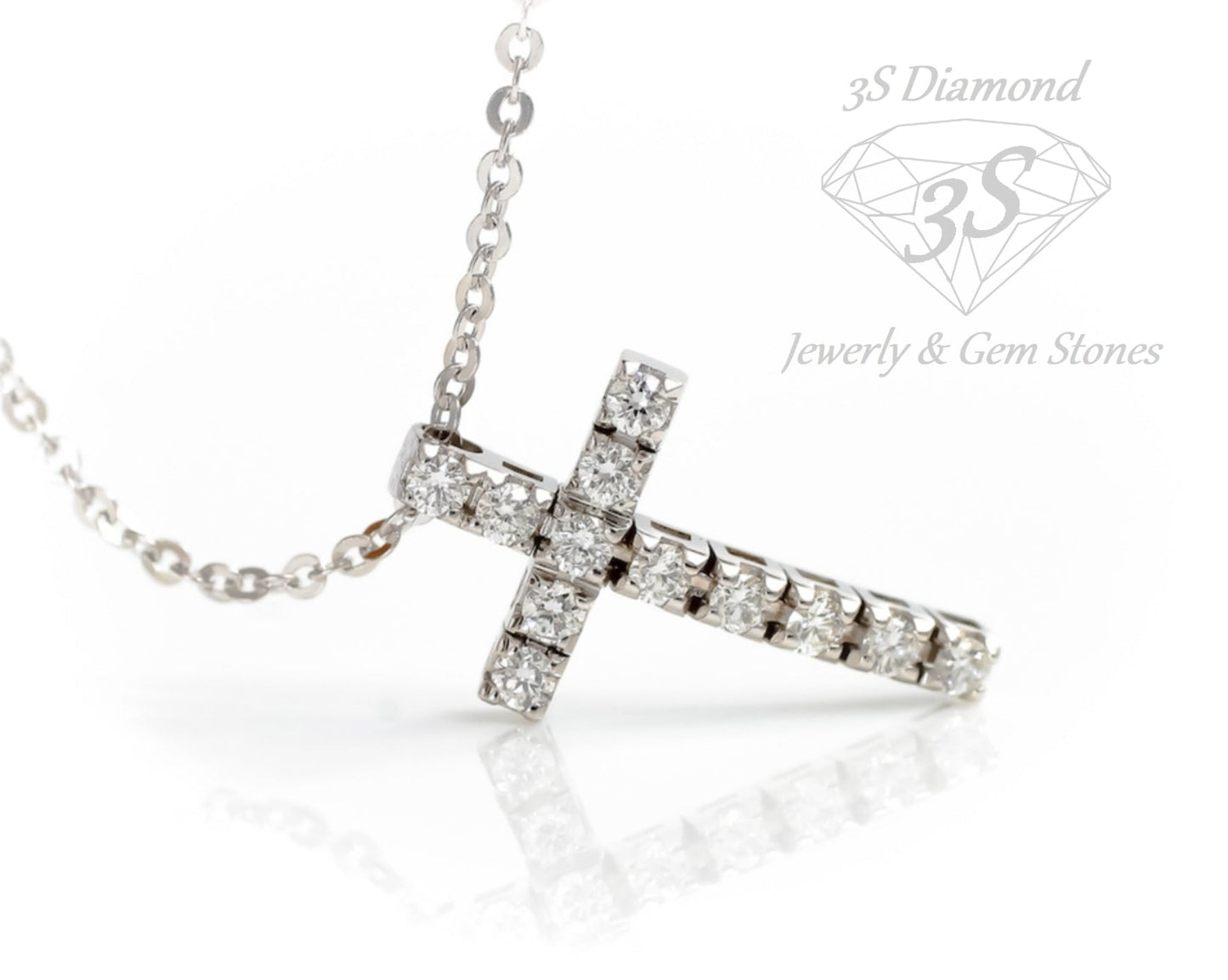 ciondolo croce in oro bianco 18k e 11 diamanti naturali 0,99 ct